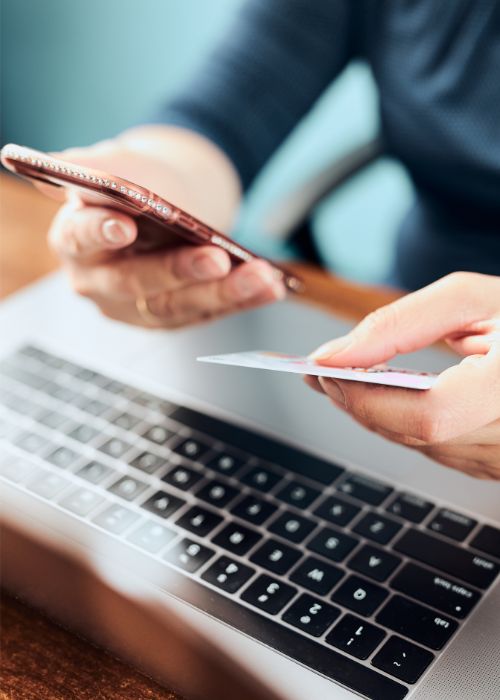 A man making an online payment with his mobile phone.