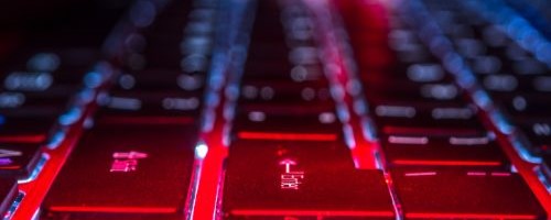 A red keyboard being worked on in a red teaming campaign